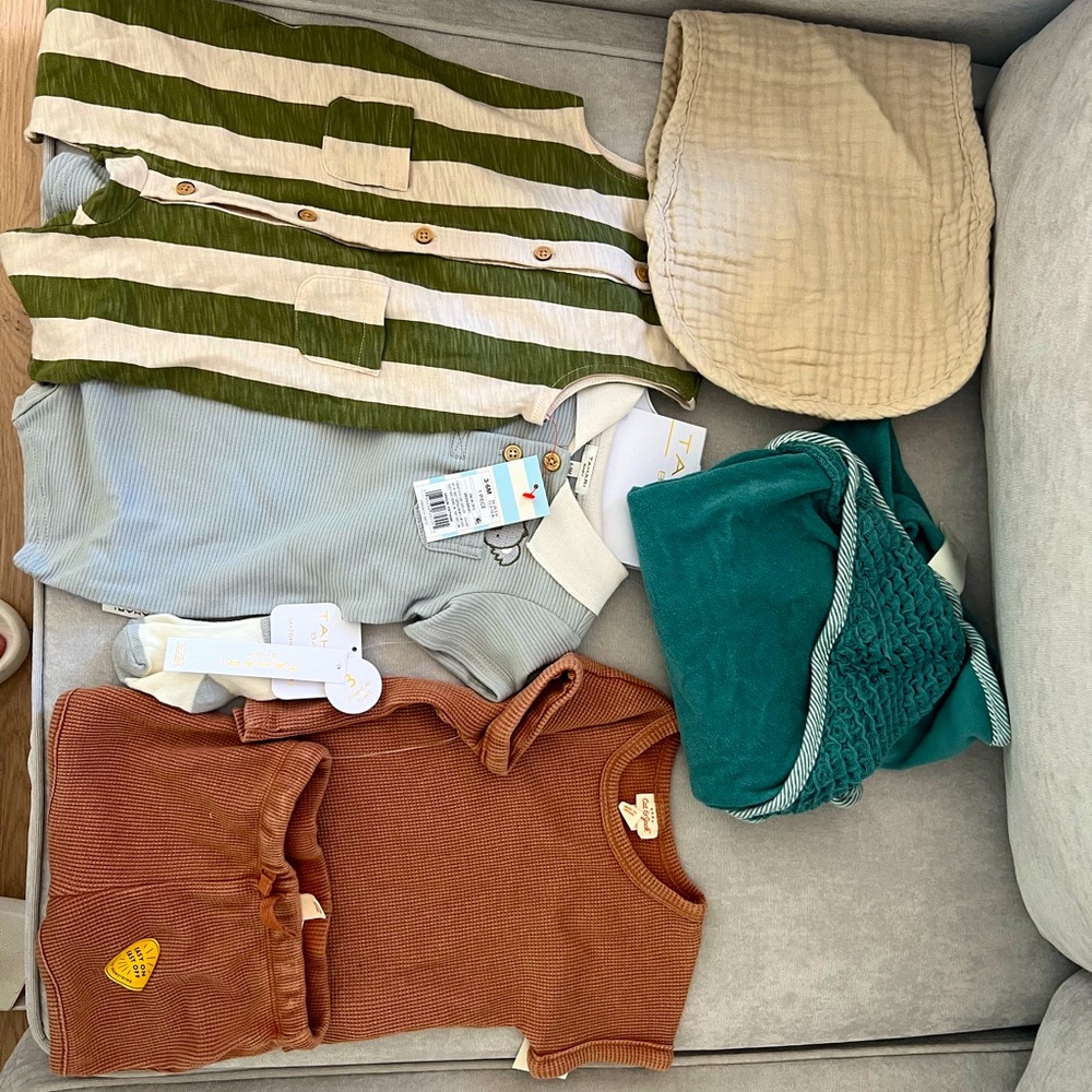 A bag of baby clothes newborn size to 3 months old.